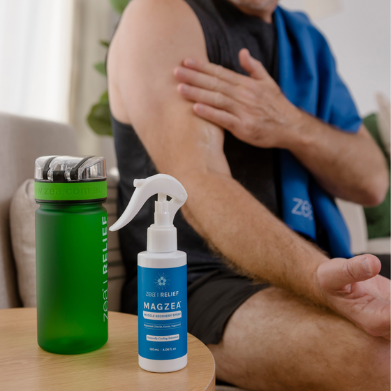 MAGZEA Muscle Recovery Spray applied to a sore shoulder after training