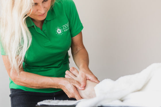 Kunzea Pain Relief Cream massaged into a sore foot and heel
